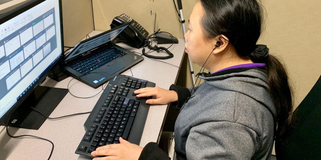 photo of woman working on a computer