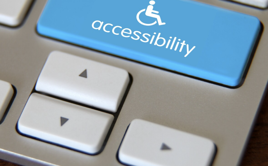 photo of keyboard with blue accessibility button featuring universal wheelchair symbol