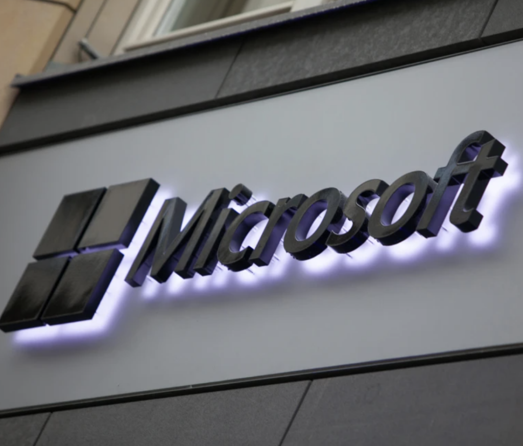 photo of Microsoft logo backlit on a wall