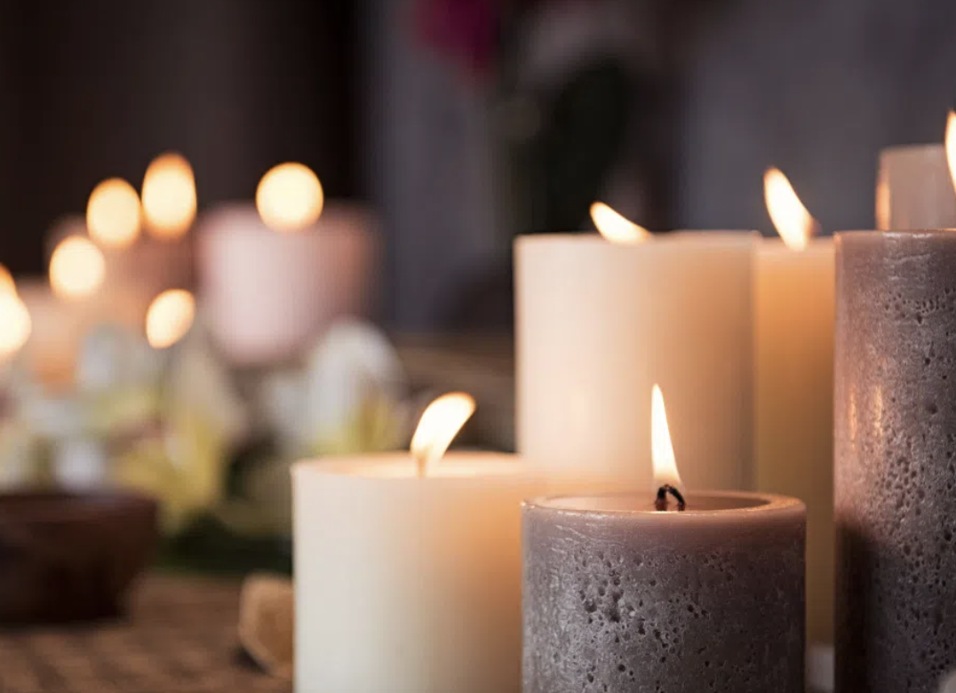 photo of lit candles in a group