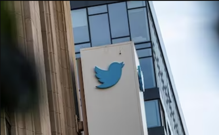 photo of twitter logo on side of building