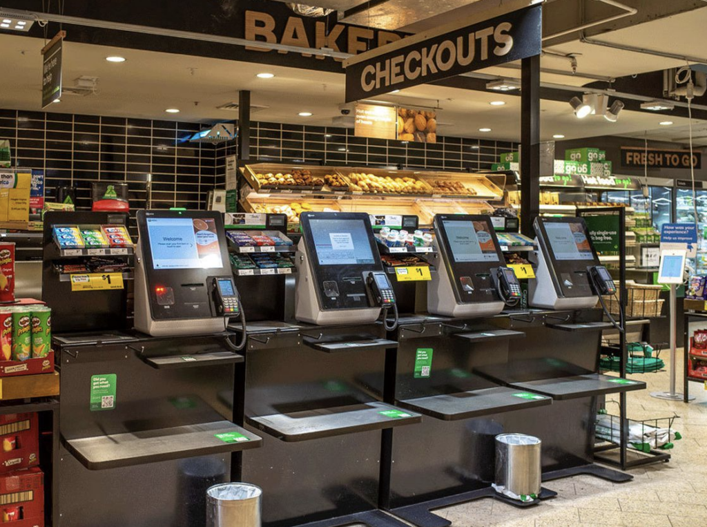 photo of touchscreen checkout stands at grocery store