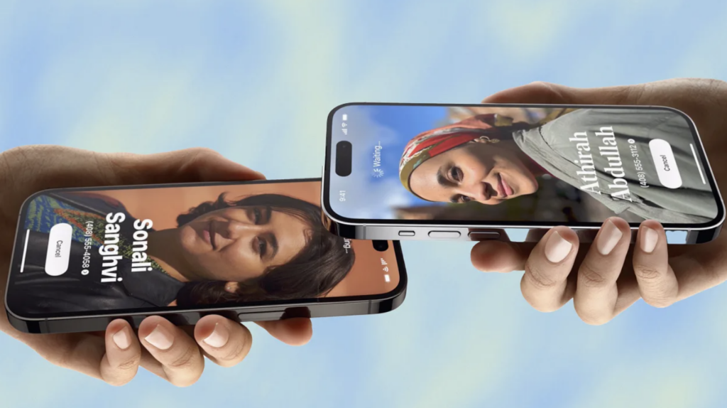 photo of two hands holding two different iphones. each has a photo of the other's face
