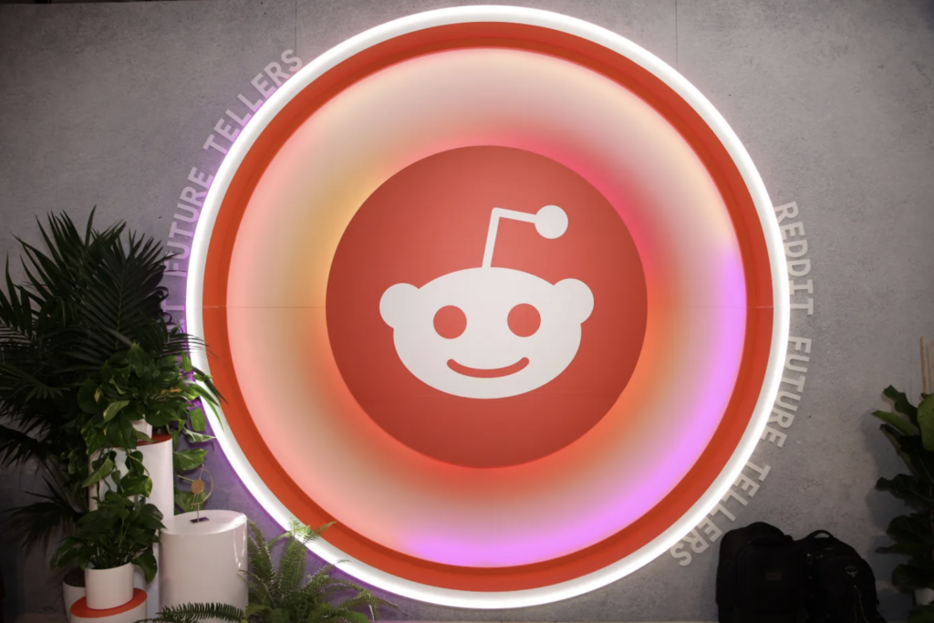 photo of Reddit company logo on a wall
