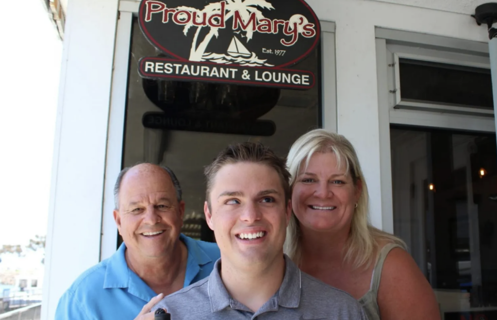 photo of restaurant owner family smiling for camera